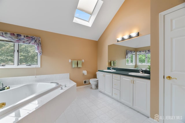 18 Stout Dr, Hillsborough, NJ 08844 - full bath featuring a skylight, double vanity, a garden tub, tile patterned floors, and high vaulted ceiling