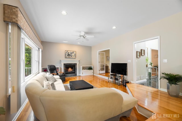 18 Stout Dr, Hillsborough, NJ 08844 - living area featuring wood finished floors, a premium fireplace, a ceiling fan, and recessed lighting