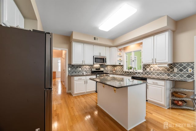 18 Stout Dr, Hillsborough, NJ 08844 - kitchen featuring appliances with stainless steel finishes, white cabinets, and light wood finished floors