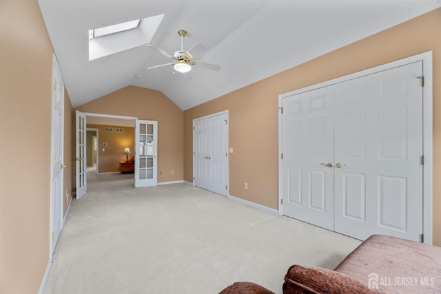 18 Stout Dr, Hillsborough, NJ 08844 - bedroom featuring a skylight, vaulted ceiling, light carpet, two closets, and a ceiling fan
