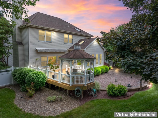 18 Stout Dr, Hillsborough, NJ 08844 - back of property at dusk featuring a gazebo, a wooden deck, a chimney, and a shingled roof