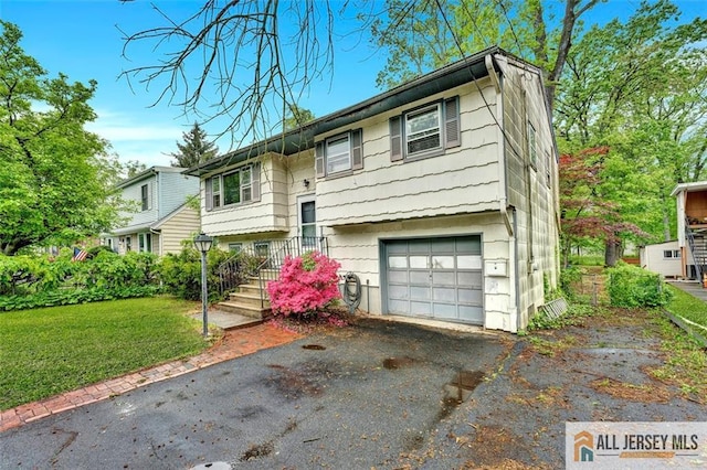91 Amherst Ave, Colonia, NJ 07067 - raised ranch with a garage, driveway, and a front lawn