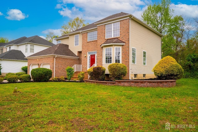 24 Chesapeake Rd, South Brunswick, NJ 08852 - view of front facade featuring a front lawn, brick siding, and a garage