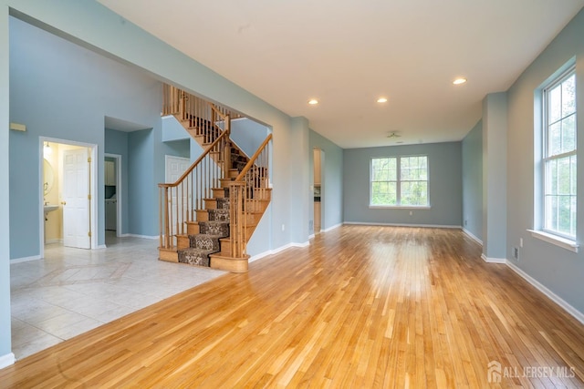 24 Chesapeake Rd, South Brunswick, NJ 08852 - unfurnished living room with stairs, recessed lighting, and wood finished floors