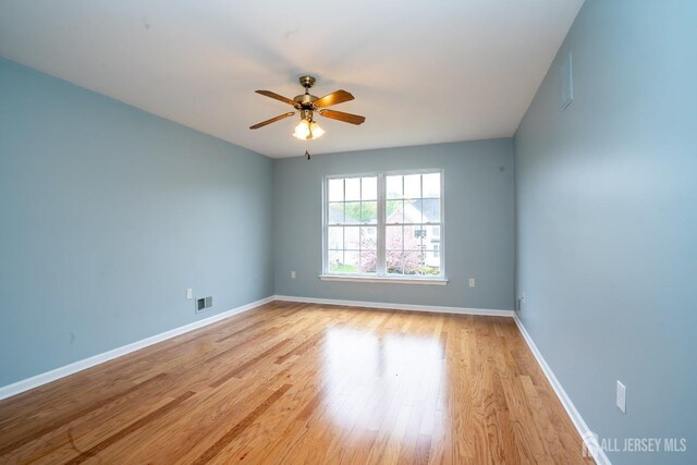 24 Chesapeake Rd, South Brunswick, NJ 08852 - spare room with light wood-type flooring, ceiling fan, baseboards, and visible vents