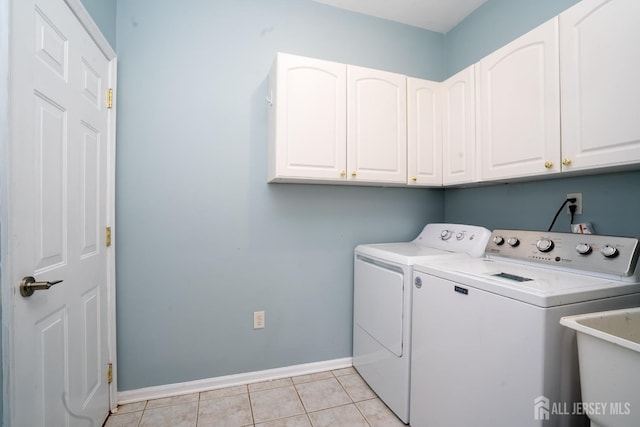 24 Chesapeake Rd, South Brunswick, NJ 08852 - laundry area featuring light tile patterned floors, a sink, cabinet space, baseboards, and independent washer and dryer