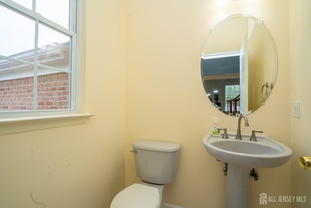 24 Chesapeake Rd, South Brunswick, NJ 08852 - half bathroom featuring toilet and a wealth of natural light