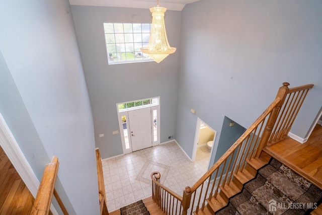 24 Chesapeake Rd, South Brunswick, NJ 08852 - entryway featuring baseboards, a wealth of natural light, and a high ceiling