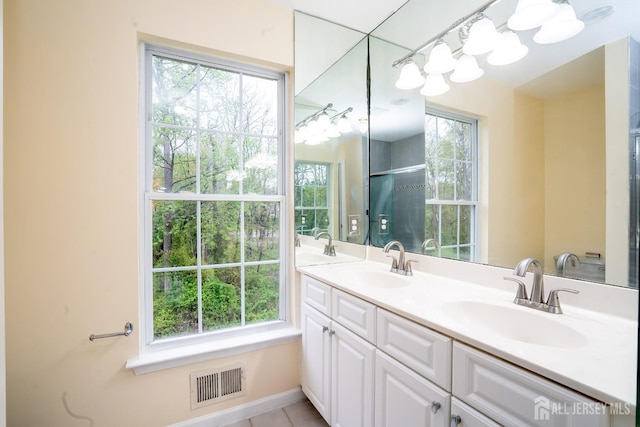 24 Chesapeake Rd, South Brunswick, NJ 08852 - bathroom with double vanity, visible vents, tile patterned flooring, and a sink