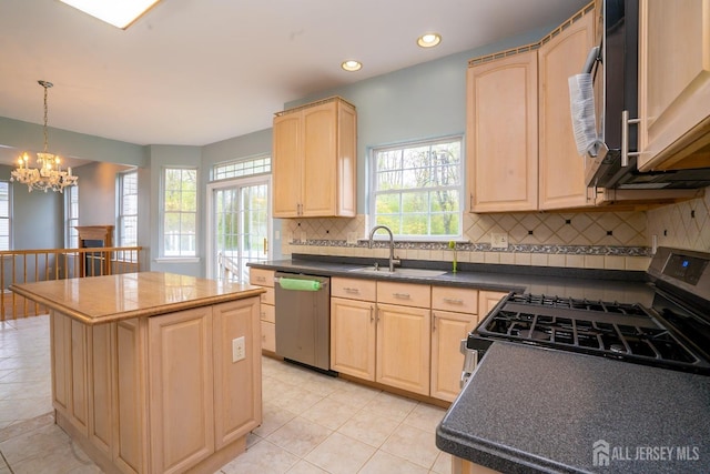 24 Chesapeake Rd, South Brunswick, NJ 08852 - kitchen with a sink, light brown cabinetry, a center island, a notable chandelier, and appliances with stainless steel finishes