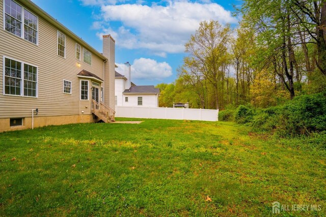 24 Chesapeake Rd, South Brunswick, NJ 08852 - view of yard featuring entry steps and fence