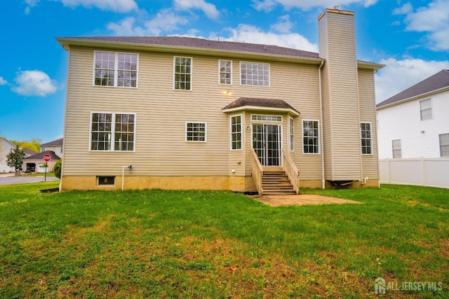 24 Chesapeake Rd, South Brunswick, NJ 08852 - rear view of property featuring a yard, a chimney, entry steps, and fence