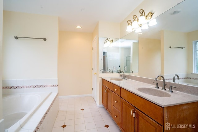 24 Chesapeake Rd, South Brunswick, NJ 08852 - bathroom with double vanity, a bath, tile patterned floors, and a sink