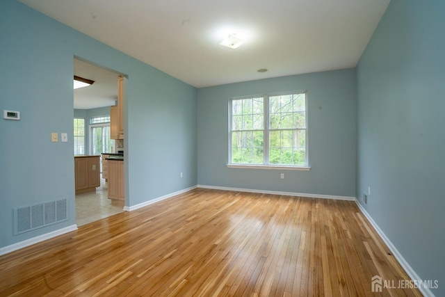 24 Chesapeake Rd, South Brunswick, NJ 08852 - spare room featuring light wood-style flooring, baseboards, and visible vents