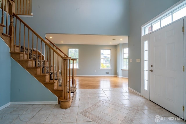 24 Chesapeake Rd, South Brunswick, NJ 08852 - entrance foyer featuring a towering ceiling, baseboards, and recessed lighting