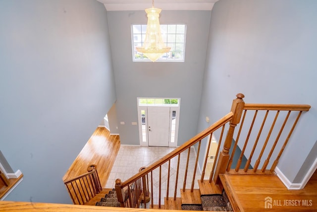 24 Chesapeake Rd, South Brunswick, NJ 08852 - entryway with baseboards, stairway, and a healthy amount of sunlight