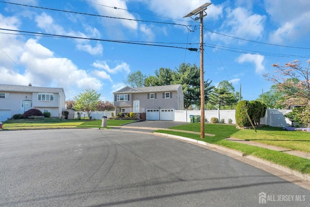 18 Velikan Pl, Edison, NJ 08817 - raised ranch featuring an attached garage and asphalt driveway