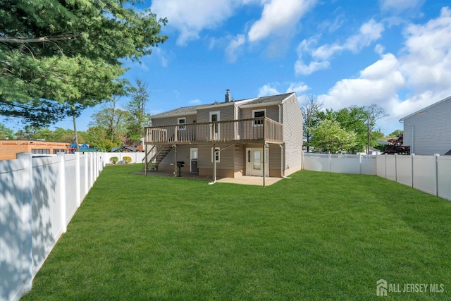 rear view of house featuring stairway, a wooden deck, and a patio