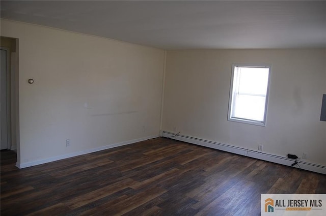 unfurnished room with baseboards, wood finished floors, and a baseboard radiator