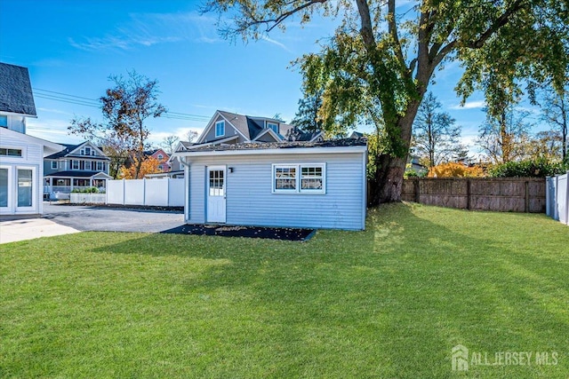 view of outbuilding featuring a yard