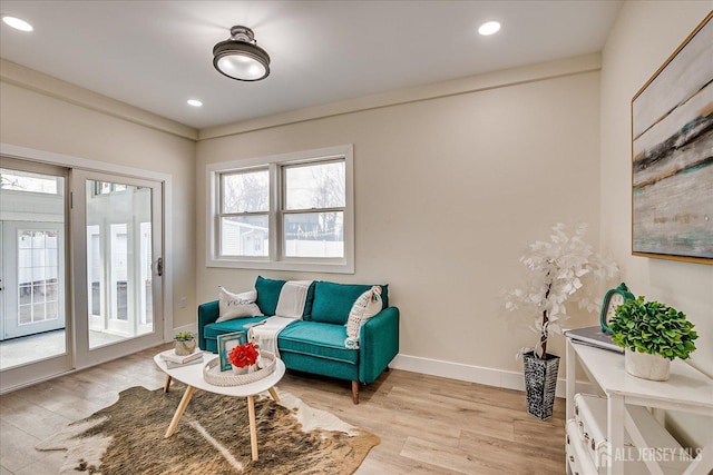 sitting room featuring light hardwood / wood-style flooring