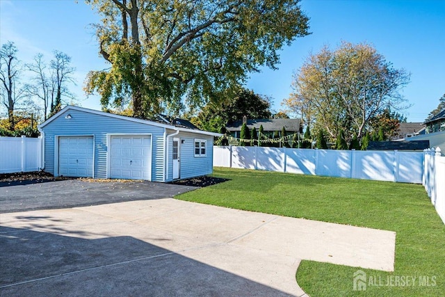 garage featuring a yard