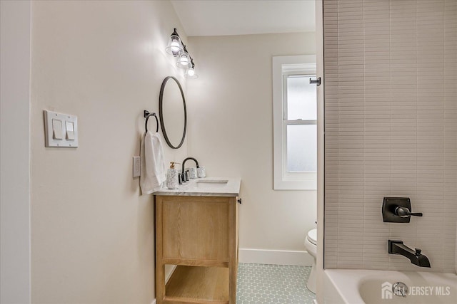 bathroom featuring toilet, tile patterned floors, and vanity