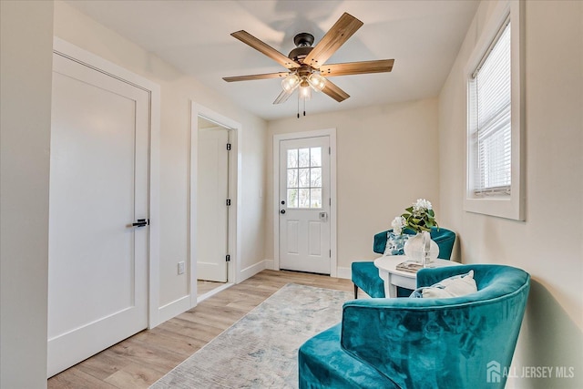 foyer entrance featuring ceiling fan and light hardwood / wood-style floors