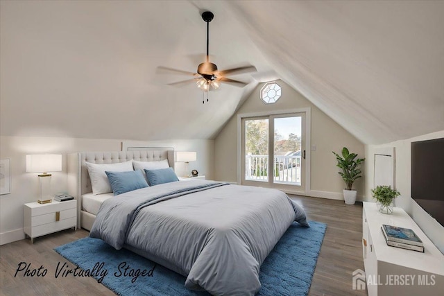 bedroom with ceiling fan, hardwood / wood-style flooring, access to outside, and lofted ceiling