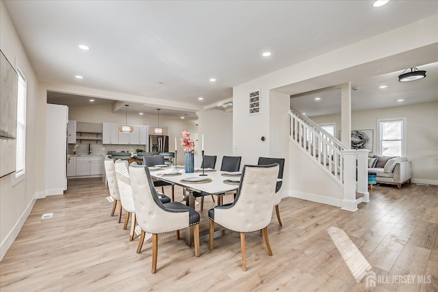 dining space featuring light hardwood / wood-style flooring