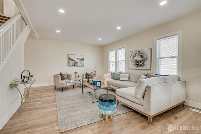 living room with light hardwood / wood-style flooring