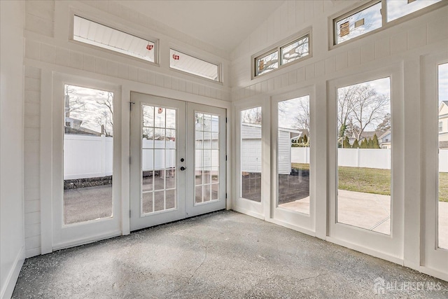 interior space featuring french doors and vaulted ceiling