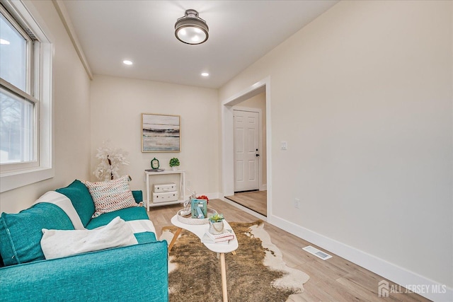 living area with wood-type flooring