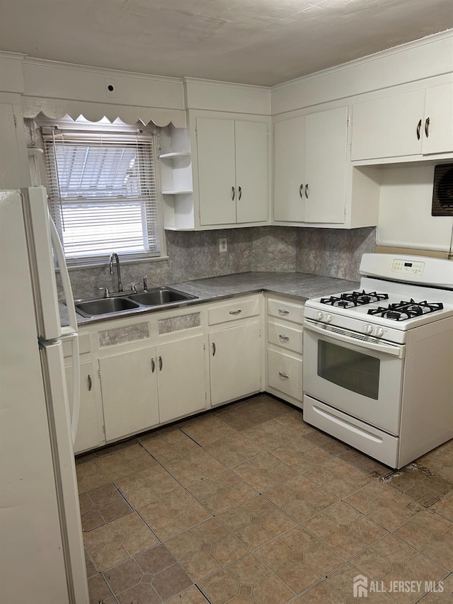 kitchen with a sink, decorative backsplash, white appliances, and open shelves