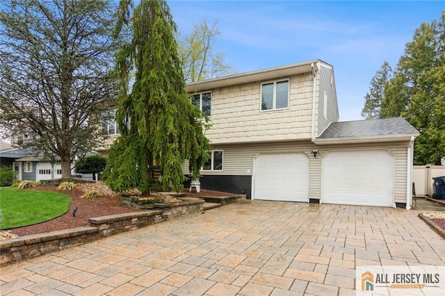 view of front of home featuring decorative driveway
