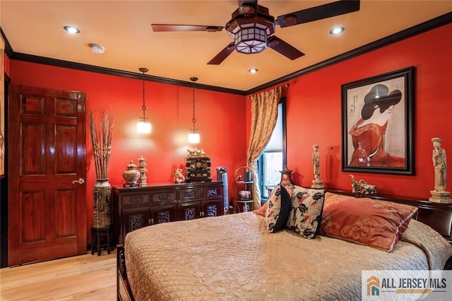 bedroom with recessed lighting, crown molding, and wood finished floors