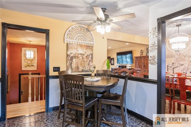 dining room with a ceiling fan