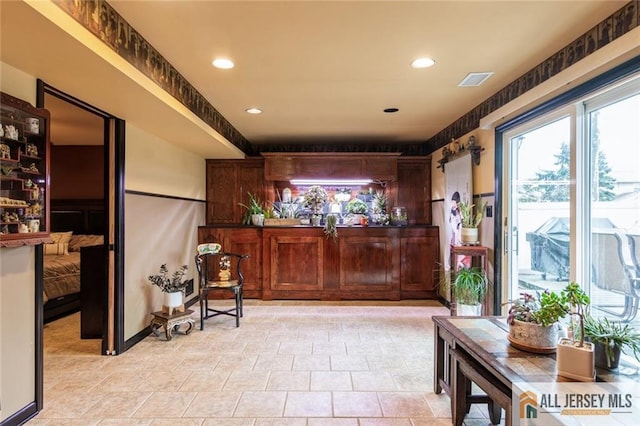 bar with recessed lighting and visible vents