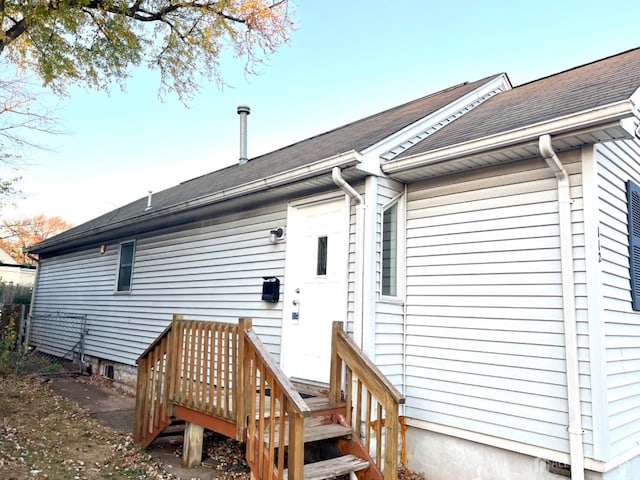 back of property featuring a wooden deck