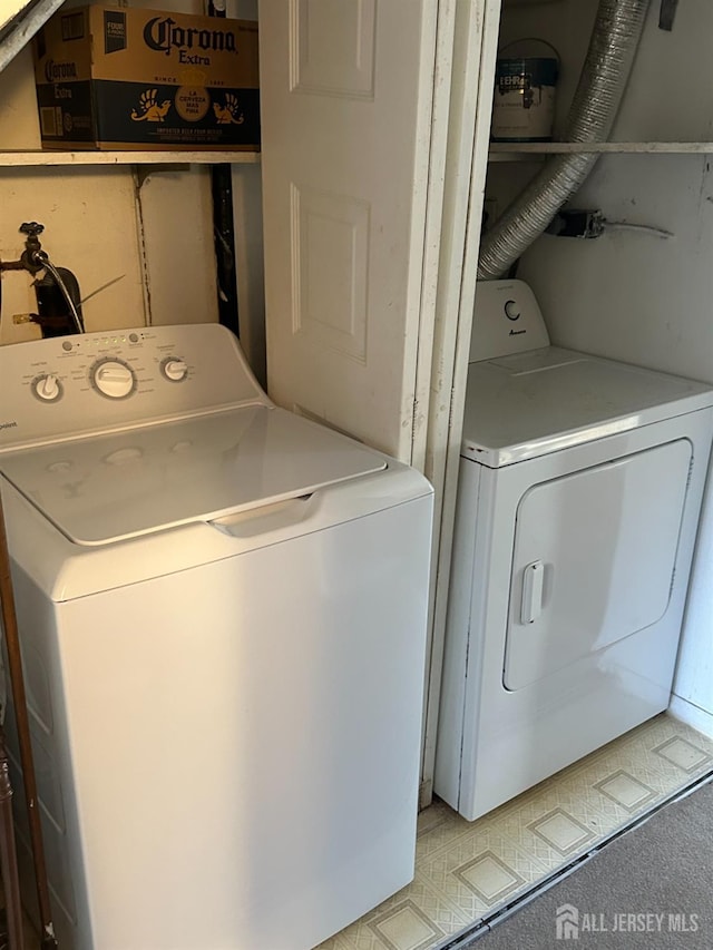 laundry area with independent washer and dryer