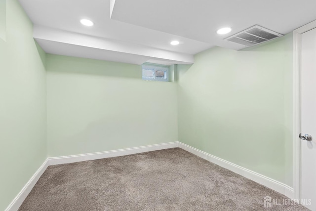 below grade area featuring baseboards, carpet floors, visible vents, and recessed lighting