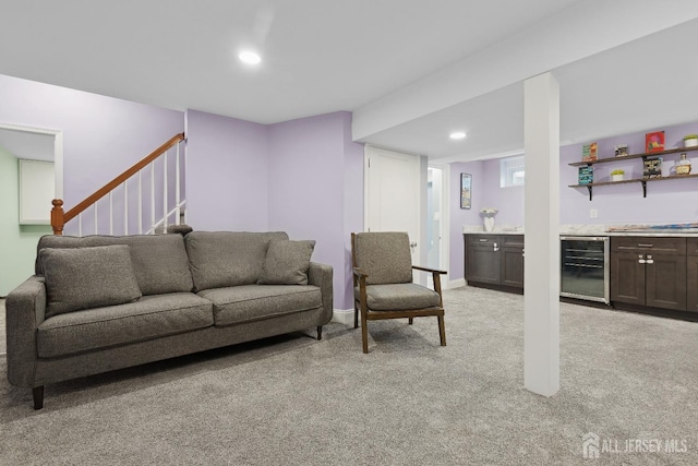 living area with indoor bar, recessed lighting, light colored carpet, beverage cooler, and stairs