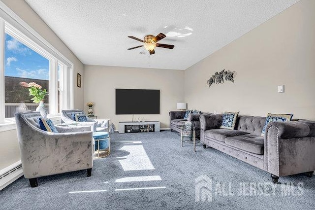 living room with carpet flooring, a textured ceiling, a baseboard heating unit, and a ceiling fan