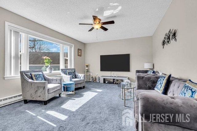 living room featuring a textured ceiling, carpet, and ceiling fan