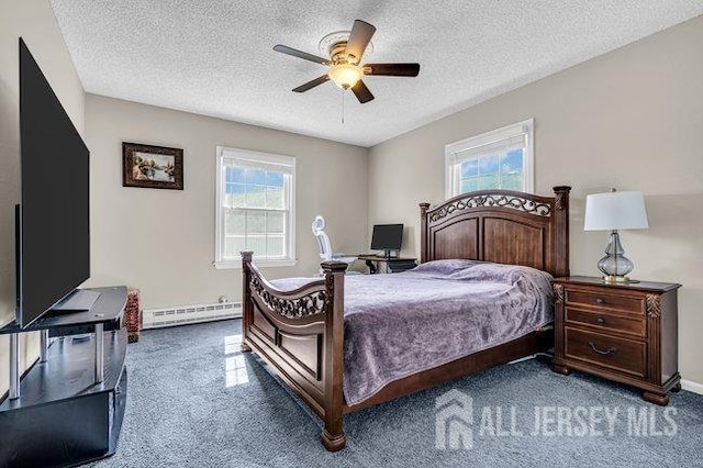 carpeted bedroom featuring multiple windows, a textured ceiling, and a baseboard radiator