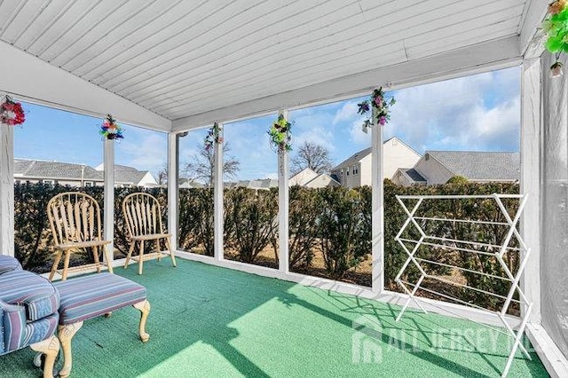 sunroom with vaulted ceiling