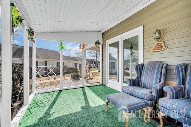 sunroom featuring wooden ceiling and vaulted ceiling