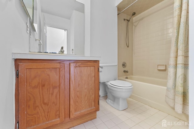 full bathroom featuring tile patterned flooring, shower / bath combo, vanity, and toilet