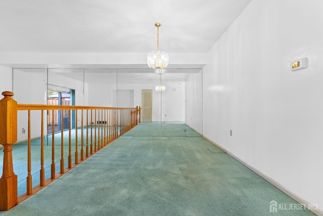 corridor with carpet and a chandelier