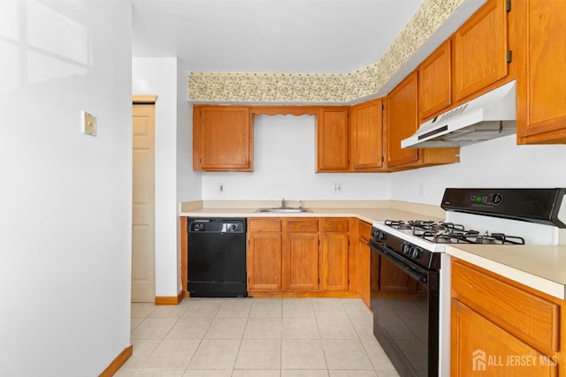 kitchen featuring light tile patterned flooring, sink, and black appliances